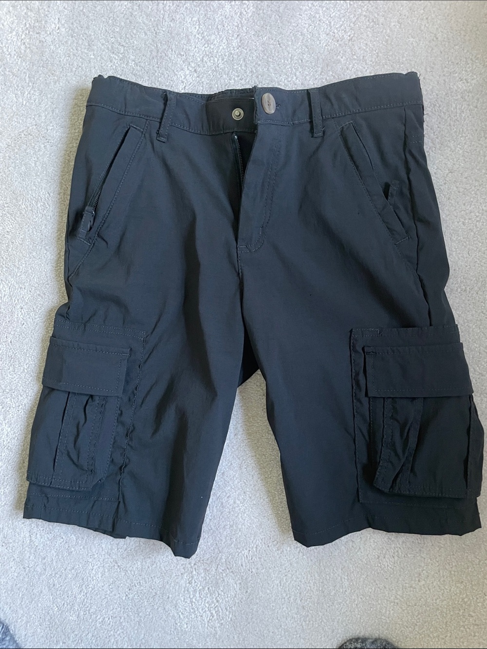 Youth size 16 quick-dry tech Cargo Shorts. Black, zip pocket